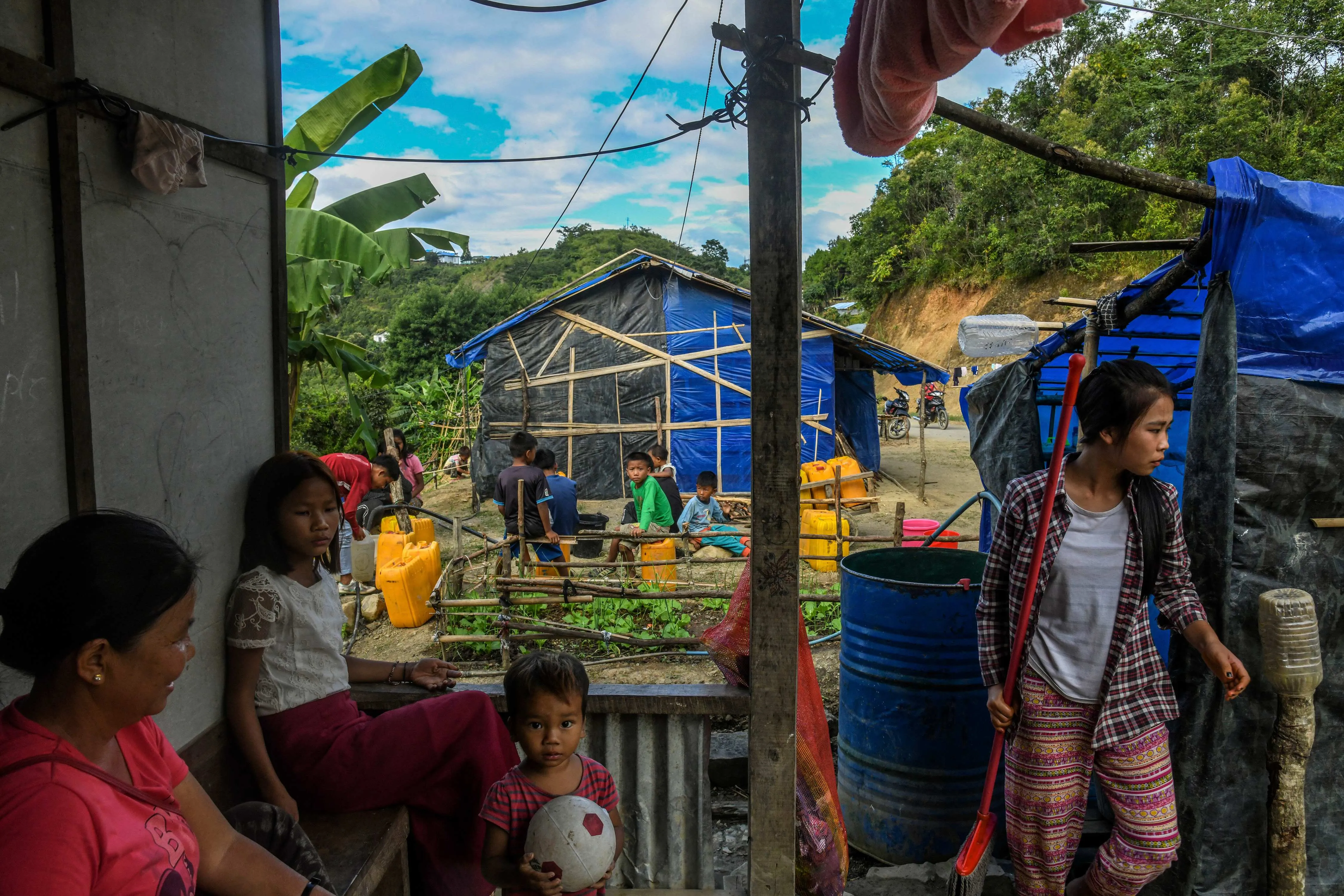 Refugees in homes built by locals in Mizoram, India, Oct. 14, 2021
